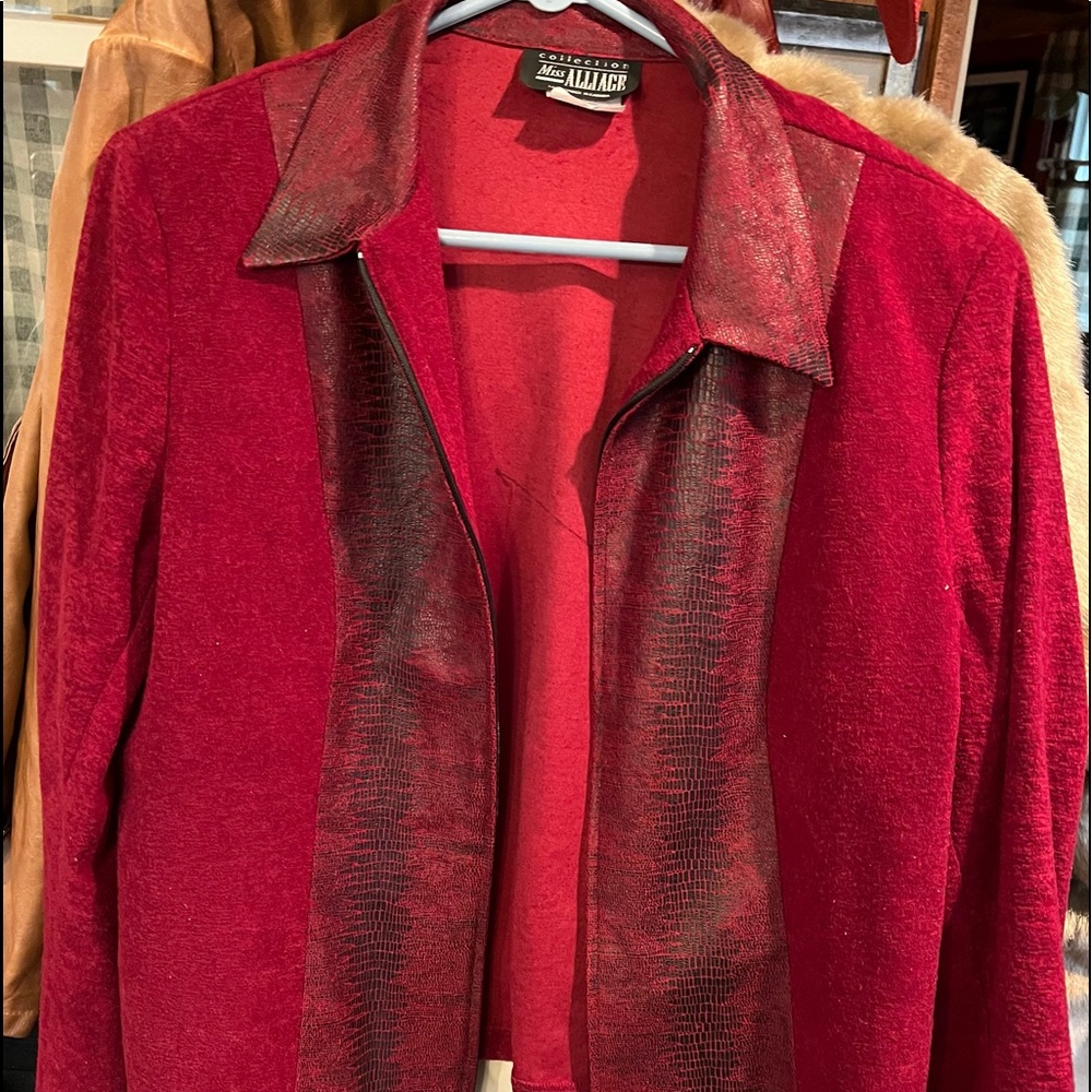 Great red top with snakeskin pattern around the middle front. And collar.